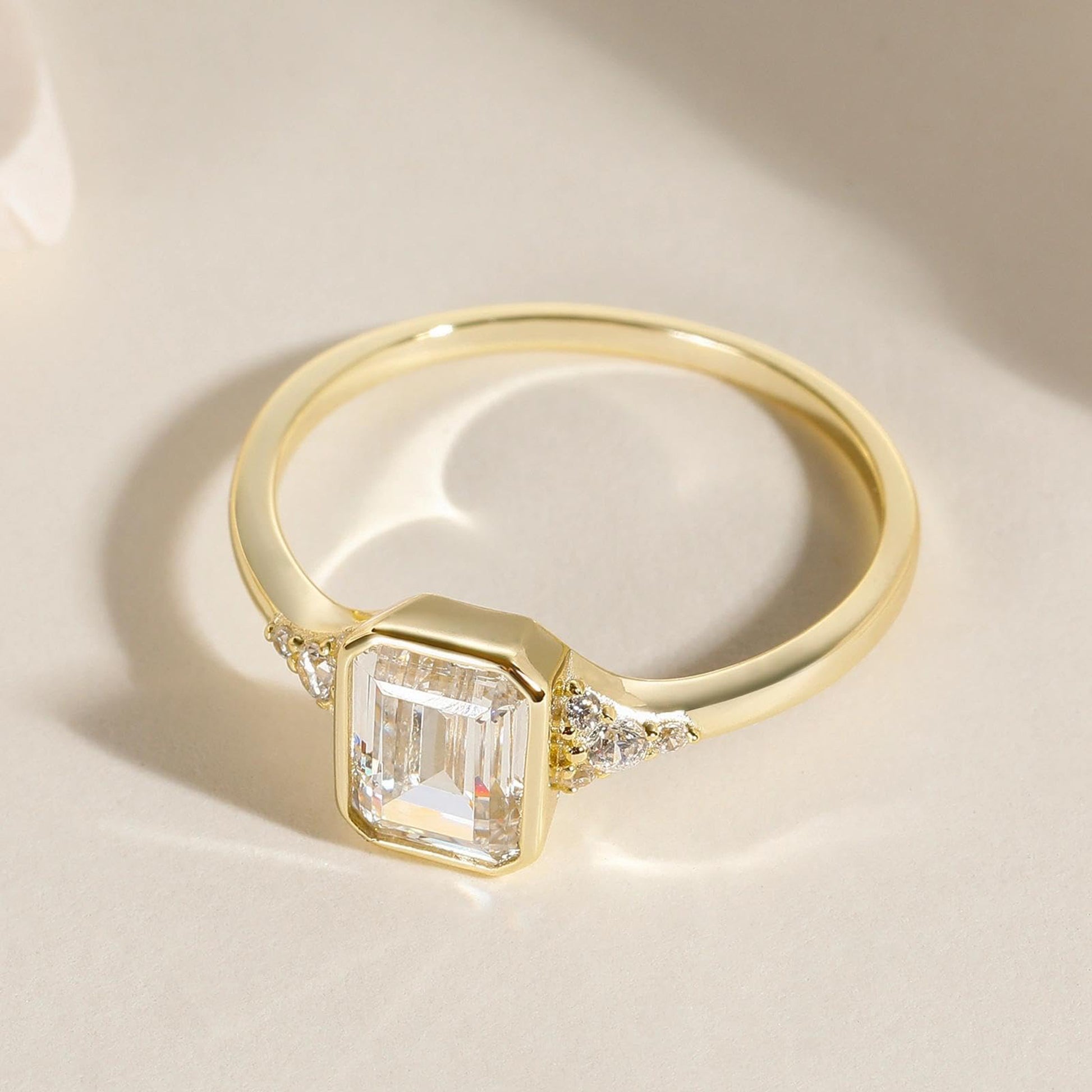 bezel engagement rings, emerald cut engagement rings, emerald cut, emerald diamond, emerald cut diamond ring, emerald cut ring, emerald diamond ring, fake diamond rings, cubic zirconia engagement rings, cubic zirconia wedding rings, silver engagement rings, cz stones, travel rings